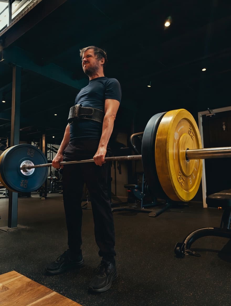 A lifter training under coaching at The Zone, Neston